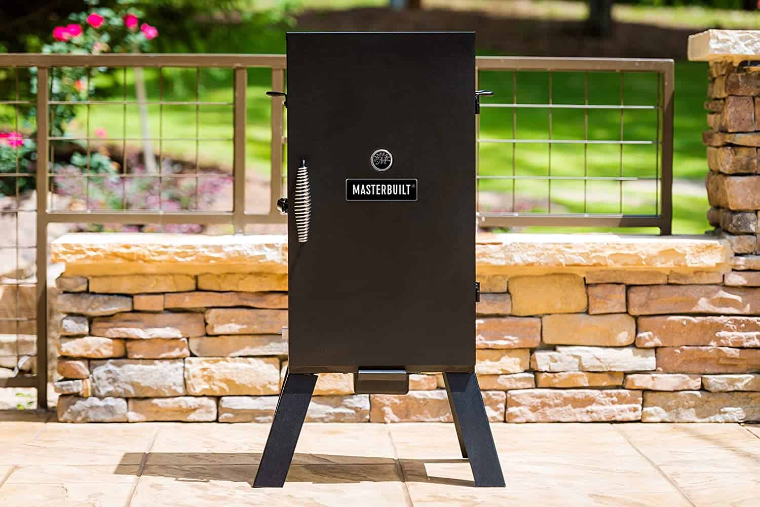 Best electric smoker for ribs (for beginners)- Masterbuilt MB20070210 in garden