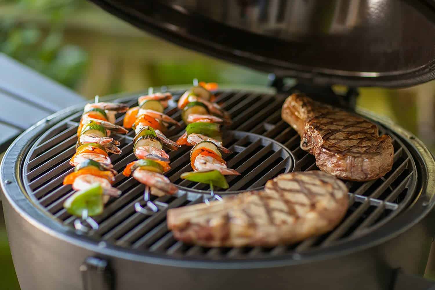 Most budget-friendly Kamado grill- Char Griller Akorn cooking meat