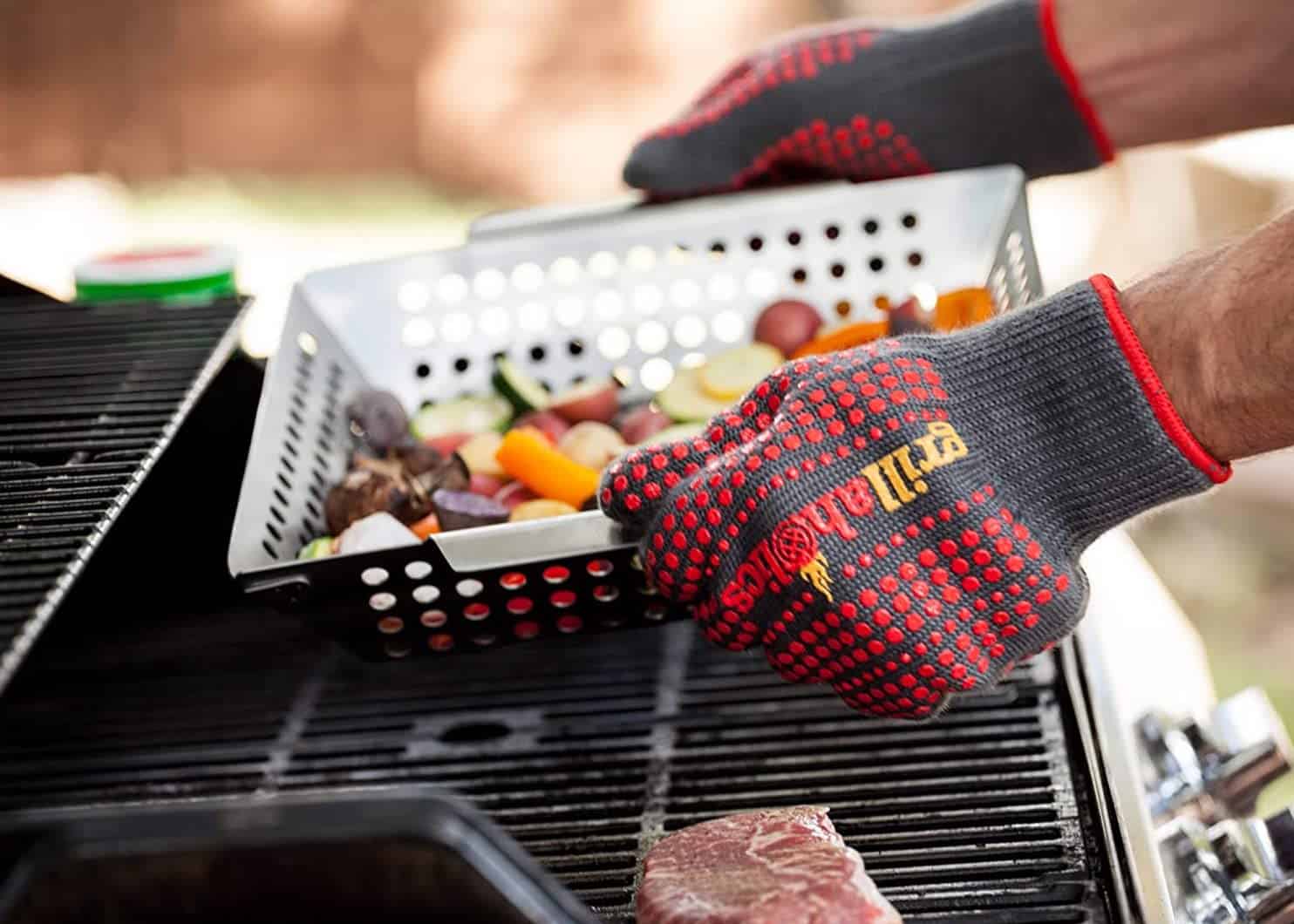 Best silicone BBQ gloves- Grillaholics Silicone Barbecue Gloves grabbing grill basket